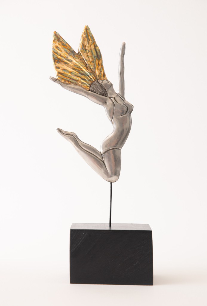 Woman with golden wings. Embossed pewter statue 300 x 90mm by artist Sandy Griffiths.
