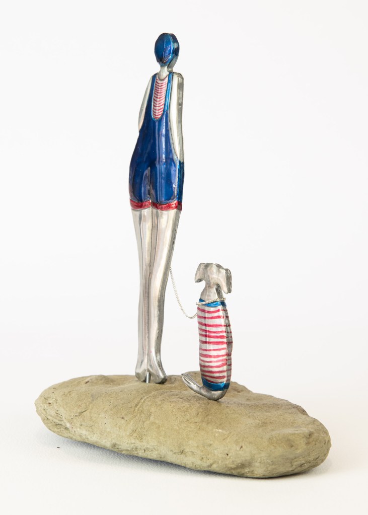 Lady and her dog statues. 220x180. Embossed Pewter artwork by Sandy Griffiths.