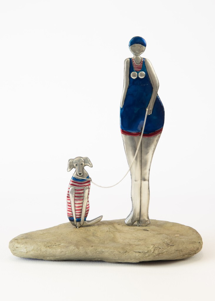 Lady and her dog statues. 220x180. Embossed Pewter by Sandy Griffiths.