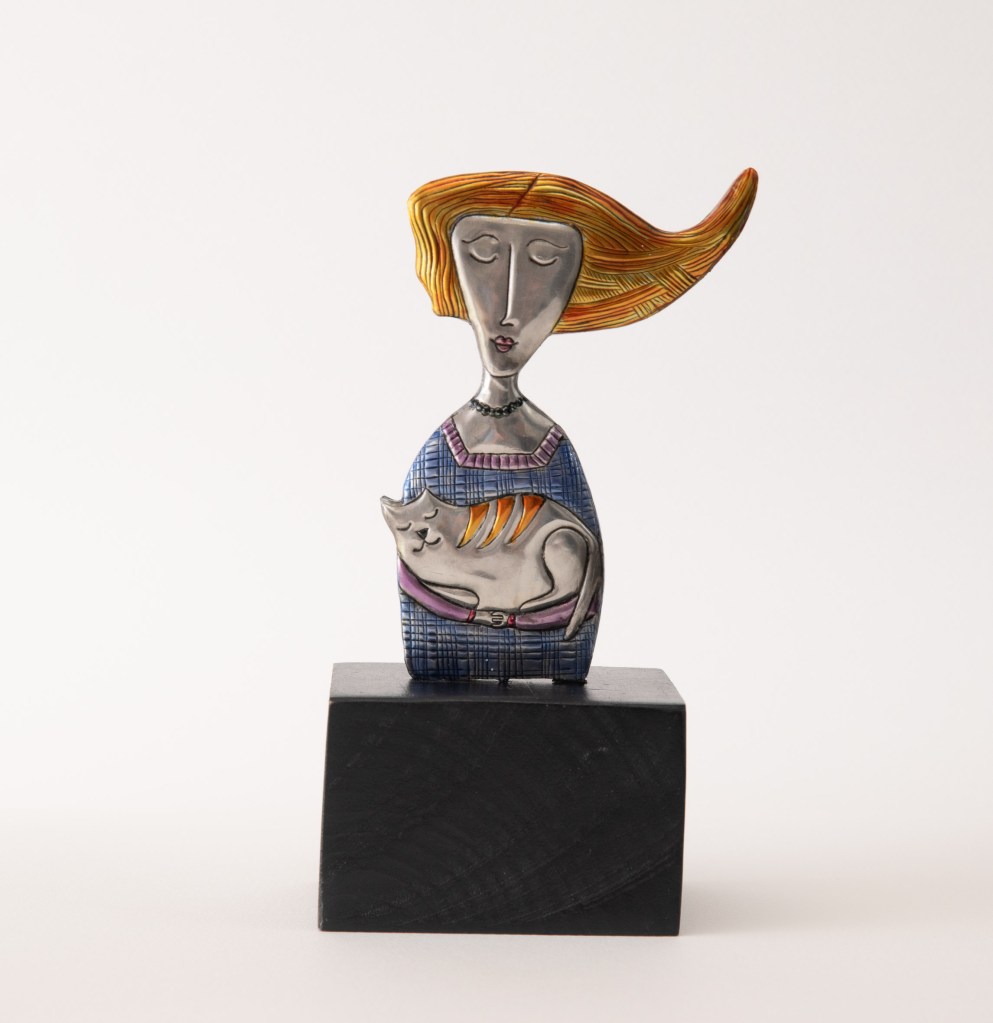 Redhead girl with cat. Embossed pewter statue 220 x 80mm by artist Sandy Griffiths.