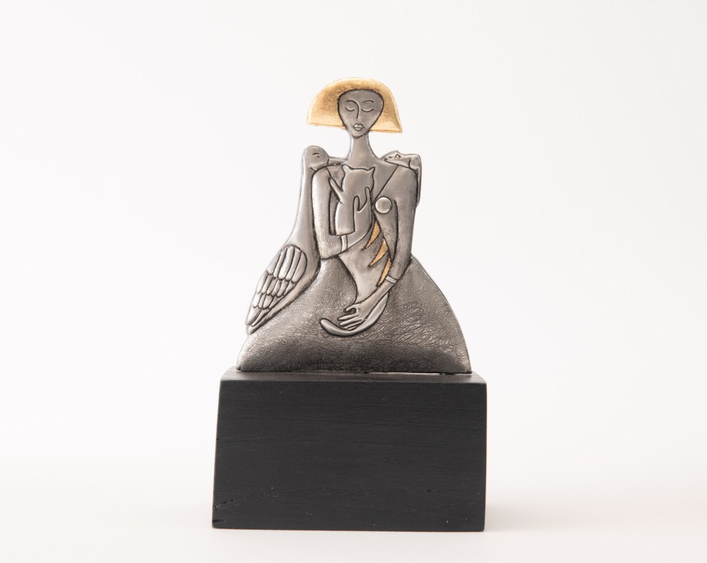 Girl with friends. 210 x 110mm Embossed pewter statue by artist Sandy Griffiths.