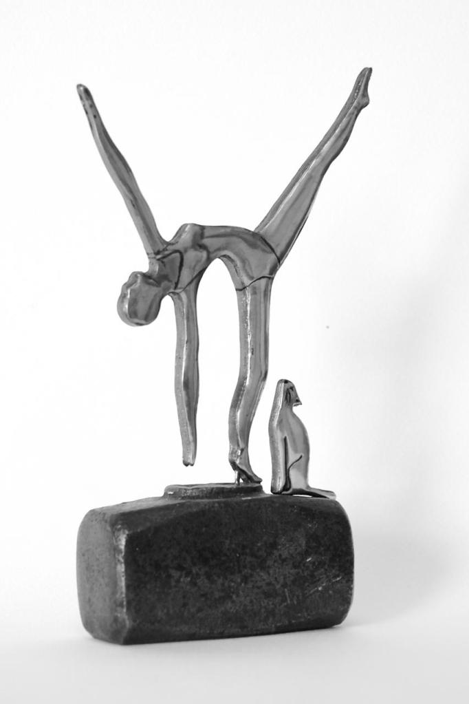 Artwork Dancer with a cat mounted on a vintage sledgehammer head. Embossed pewter statue by Sandy Griffiths.