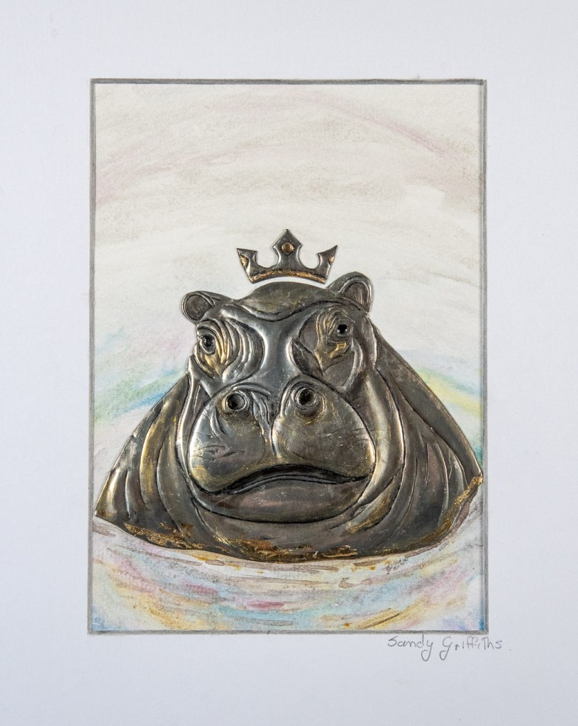 Hand-embossed pewter Hippopotamus with gold leaf and paint set on a watercolour background in a white box frame by Sandy Griffiths.