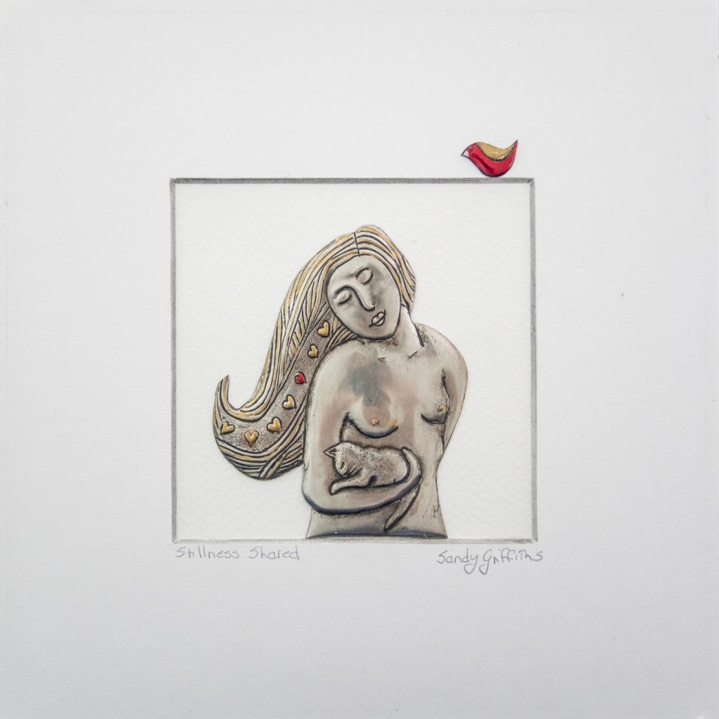 Stillness shared: Hand-embossed pewter and gold leaf girl with her cat in a black box frame, by Sandy Griffiths. 230 x 230mm. R1500.00